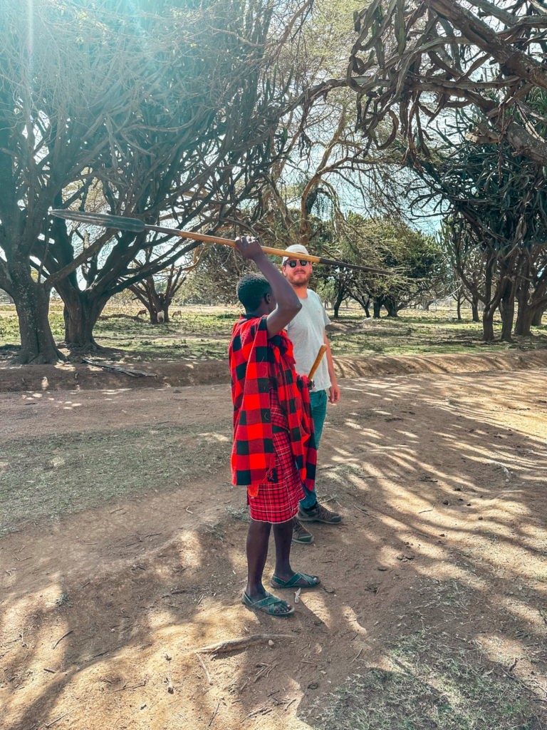 Experiencing Authentic Maasai Culture learning to throw a spear