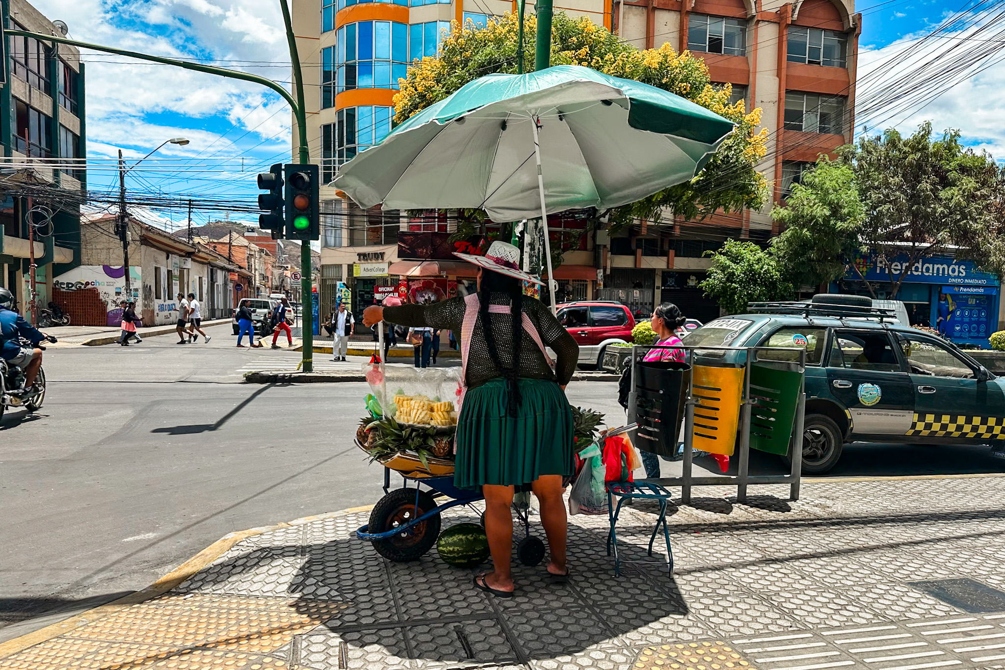 Best Things to Do in Cochabamba, Bolivia: Cholita selling fruits on the street
