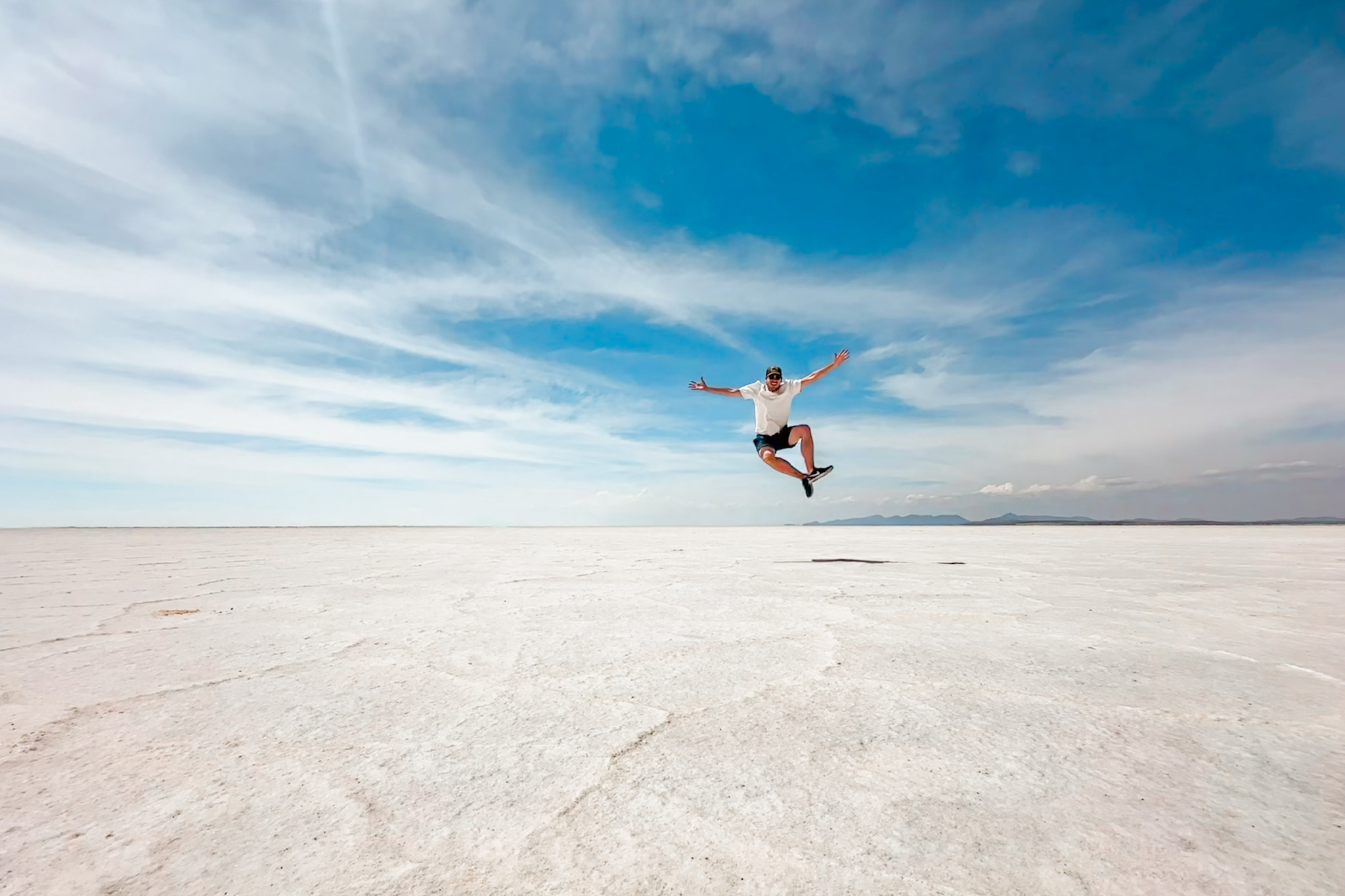 Uyuni Travel Guide: Jumping in the air in the largest salt flat in the world