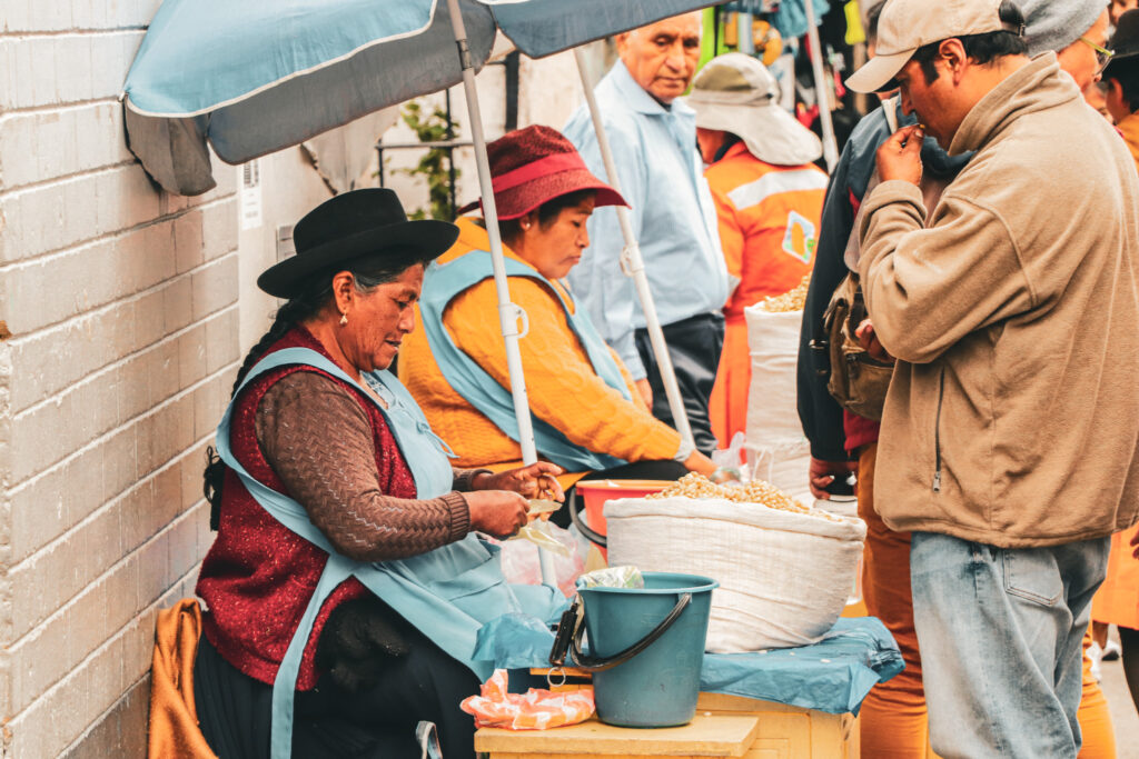Best Things to Do in Sucre, Bolivia: Cholitas selling nuts at the market